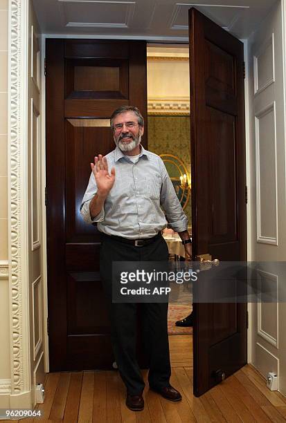 Sinn Fein President Gerry Adams waves to the media before a press conference at Hillsborough Castle in Hillsborough, Northern Ireland January 27,...
