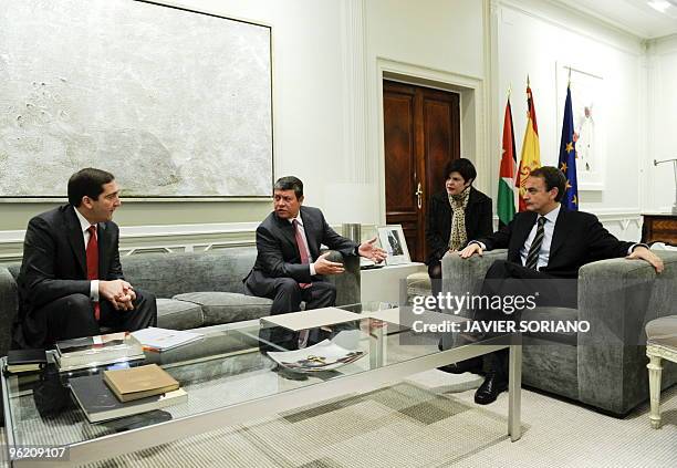 Spain's Prime Minister Jose Luis Rodriguez Zapatero talks with Jordan's King Abdullah II and Jordan's Prime Minister Samir Rifai during a meeting at...