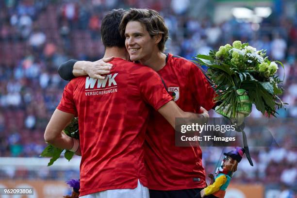 Gojko Kacar of Augsburg hugs Goalkeeper Marvin Hitz of Augsburg after the Bundesliga match between FC Augsburg and FC Schalke 04 at WWK-Arena on May...