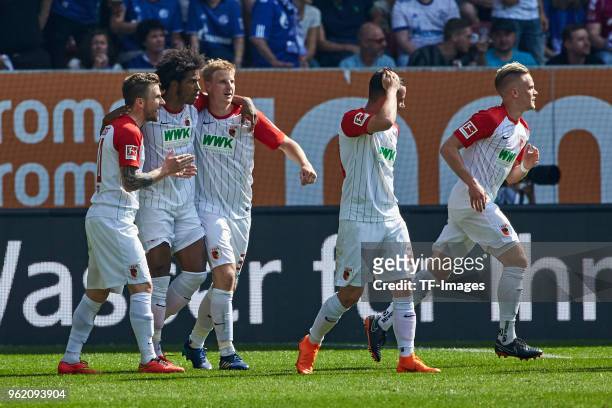 Philipp Max of Augsburg celebrates after scoring his team`s first goal with Daniel Baier of Augsburg, Francisco da Silva Caiuby of Augsburg, Martin...