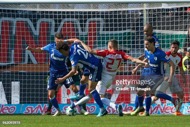 Alessandro Schoepf of Schalke, Thilo Kehrer of Schalke, Naldo of Schalke, Benjamin Stambouli of Schalke and Alfred Finnbogason of Augsburg battle for...
