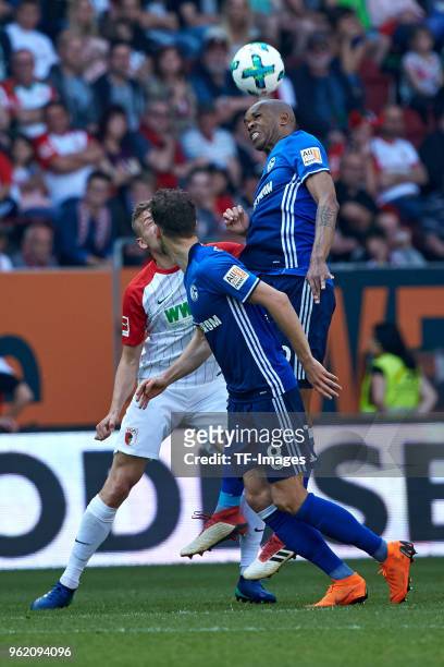 Alfred Finnbogason of Augsburg, Leon Goretzka of Schalke and Naldo of Schalke controls the ball during the Bundesliga match between FC Augsburg and...