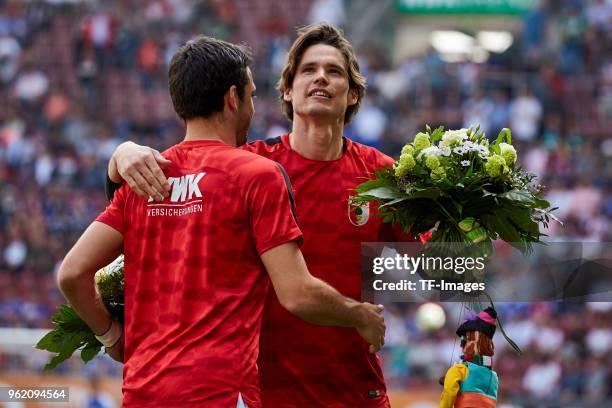 Gojko Kacar of Augsburg hugs Goalkeeper Marvin Hitz of Augsburg after the Bundesliga match between FC Augsburg and FC Schalke 04 at WWK-Arena on May...