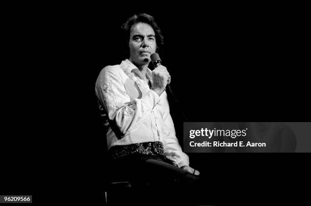 Neil Diamond performs live on stage during his 1976 tour of the USA