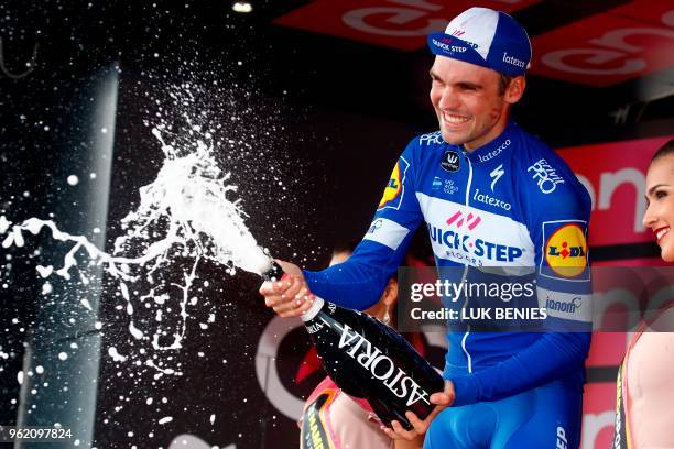 Germany's rider of team Quick-Step Maximilian Schachmann celebrates on the podium after winning the 18th stage between Abbiategrasso and Prato Nevoso...