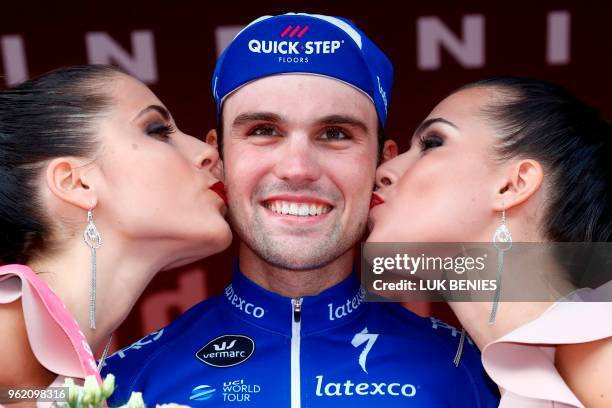 Germany's rider of team Quick-Step Maximilian Schachmann celebrates on the podium after winning the 18th stage between Abbiategrasso and Prato Nevoso...