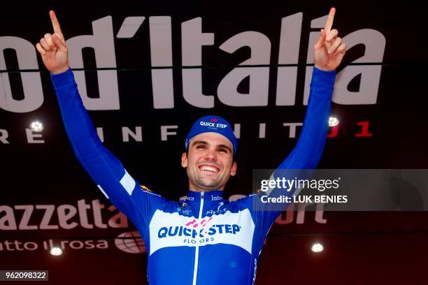 Germany's rider of team Quick-Step Maximilian Schachmann celebrates on the podium after winning the 18th stage between Abbiategrasso and Prato Nevoso...