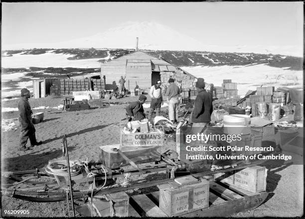 Stacking up supplies at Cape Evans on Ross Island, in the Ross Dependency of Antarctica, during Captain Robert Falcon Scott's Terra Nova Expedition...