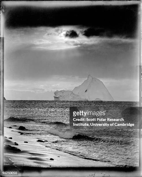 An iceberg off the coast of Cape Evans on Ross Island, in the Ross Dependency of Antarctica, during Captain Robert Falcon Scott's Terra Nova...