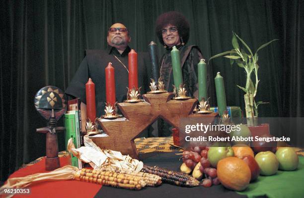 Portrait of African American author, activist, and professor Maulana Karenga with his wife Tiamoya celebrating Kwanzaa, ca.2000. Karenga created the...