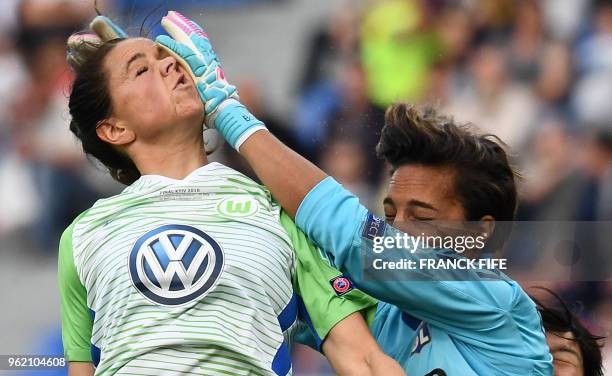 Wolfsburg's Island midfielder Sara Björk Gunnarsdottir vies with Olympique Lyonnais' French goalkeeper Sarah Bouhaddi during the UEFA Women's...