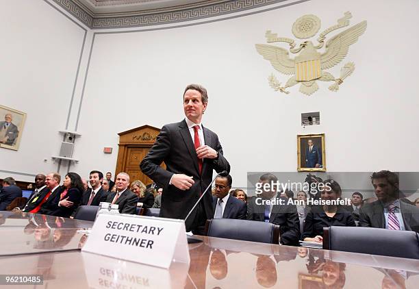 Treasury Secretary Timothy Geithner prepares to testify before a House Oversight and Government Reform Committee Hearing focusing on factors...