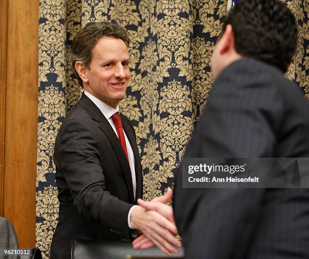 Treasury Secretary Timothy Geithner , greets Rep. Jason Chaffetz before a House Oversight and Government Reform Committee Hearing focusing on factors...