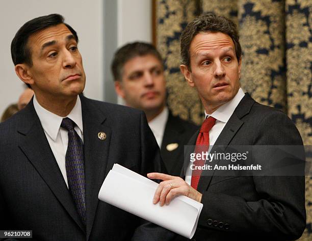 Treasury Secretary Timothy Geithner talks with Rep. Darrell Issa before a House Oversight and Government Reform Committee Hearing focusing on factors...