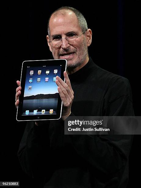 Apple Inc. CEO Steve Jobs holds up the new iPad as he speaks during an Apple Special Event at Yerba Buena Center for the Arts January 27, 2010 in San...