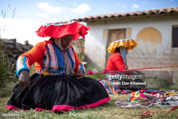 Quechua women weave on May 23, 2018 in Tinki, Peru. Many Quechua families, especially women in high altitude isolated communities have little or no...