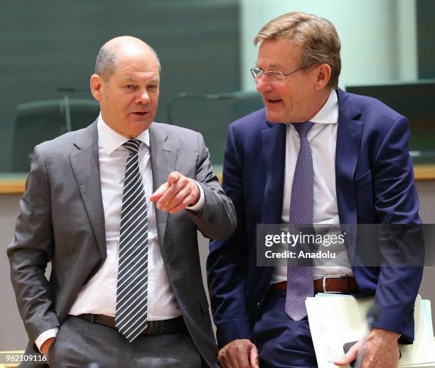 German Finance Minister Olaf Scholz and Belgian Finance Minister Johan Van Overtveldt attend the Eurogroup ministers' meeting in Brussels, Belgium on...