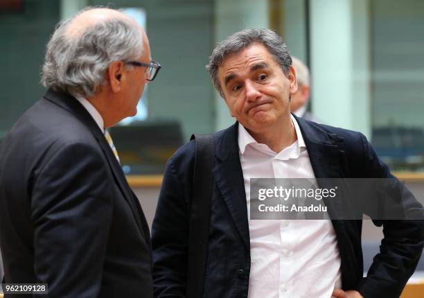 Greek Finance Minister Efklidis Cakalotos and Maltese Finance minister Edward Scicluna attend the Eurogroup ministers' meeting in Brussels, Belgium...