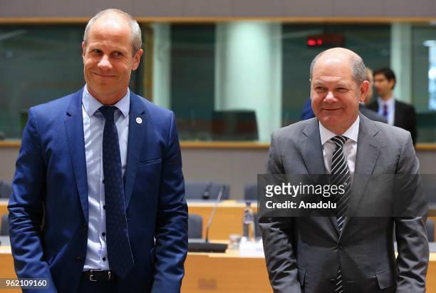 German Finance Minister Olaf Scholz and Estonian Minister of Finance Toomas Toniste attend the Eurogroup ministers' meeting in Brussels, Belgium on...