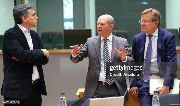 German Finance Minister Olaf Scholz , Greek Finance Minister Efklidis Cakalotos and Belgian Finance Minister Johan Van Overtveldt attend the...