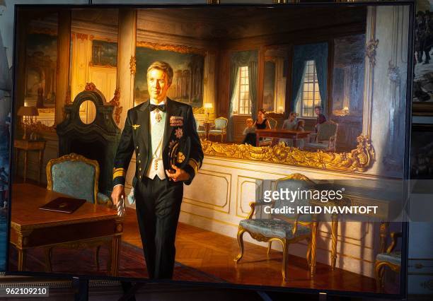 Picture taken on May 24, 2018 at Frederiksborg Castle in Hilleroed, north of Copenhagen shows a portrait of Crown Prince Frederik of Denmark by...