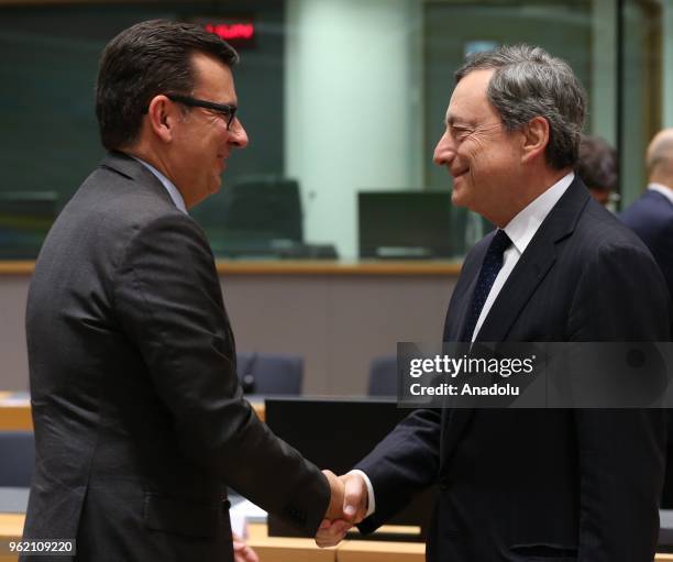 Mario Draghi , President of the European Central Bank and Spanish Finance Minister Roman Escolano attend the Eurogroup ministers' meeting in...