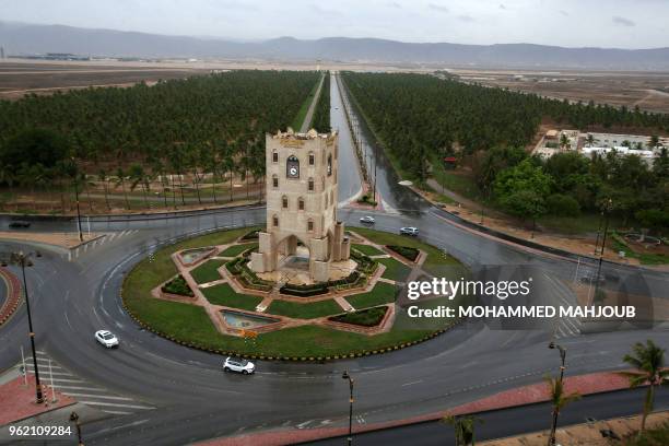 Picture taken on May 24, 2018 in the city of Salalah in southern Oman shows a view of the Burj An Nahda clocktower before the landfall of Cyclone...
