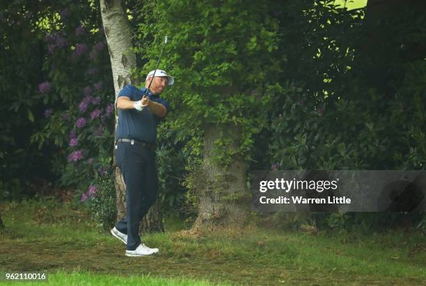 Adam Bland of Australia plays his second shot on the 4th hole during day one of the BMW PGA Championship at Wentworth on May 24, 2018 in Virginia...