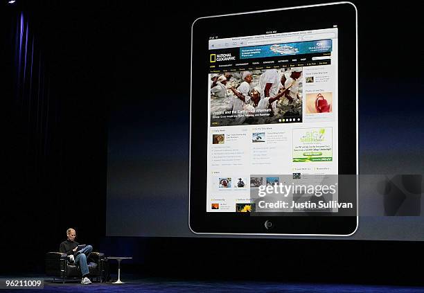 Apple Inc. CEO Steve Jobs demonstrates the new iPad as he speaks during an Apple Special Event at Yerba Buena Center for the Arts January 27, 2010 in...