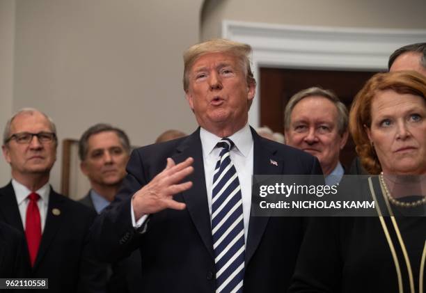 President Donald Trump speaks after signing the Economic Growth, Regulatory Relief, and Consumer Protection Act in the Roosevelt Room at the White...