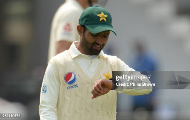 Asad Shafiq of Pakistan looks at his watch during the 1st Natwest Test match between England and Pakistan at Lord's cricket ground on May 24, 2018 in...