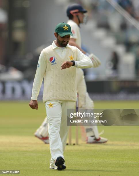 Asad Shafiq of Pakistan looks at his watch during the 1st Natwest Test match between England and Pakistan at Lord's cricket ground on May 24, 2018 in...