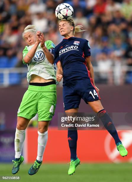 Ada Hegerberg of Lyon and Nilla Fischer of Vfl Wolfsburg compete for the ball during the UEFA Womens Champions League Final between VfL Wolfsburg and...