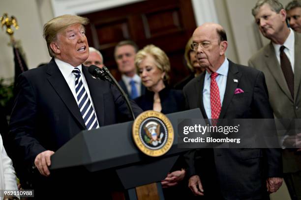 President Donald Trump, left, speaks before signing S. 2155, the Economic Growth, Regulatory Relief, And Consumer Protection Act, with administration...