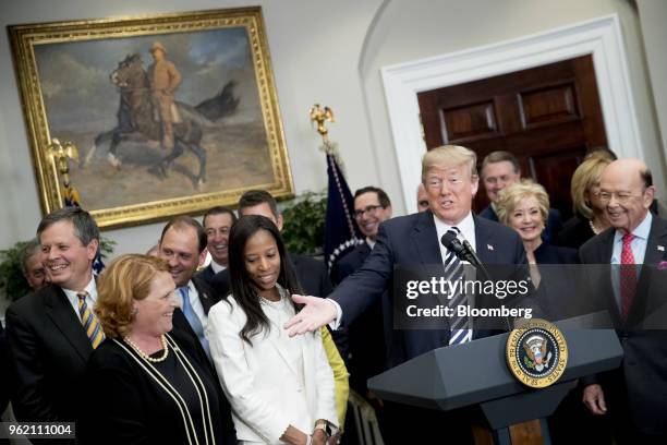 President Donald Trump, center right, speaks before signing S. 2155, the Economic Growth, Regulatory Relief, And Consumer Protection Act, with...