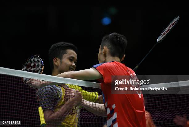 Anthony Sinisuka Ginting of Indonesia greets Lee Chong Wei of Malaysia during the Quarter-finals match on day five of the BWF Thomas & Uber Cup at...