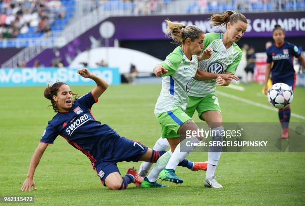 Olympique Lyonnais' French midfielder Amel majri vies with Wolfsburg's Polish forward Ewa Pajor and Wolfsburg's Swiss midfielder Lara Dickenmann...