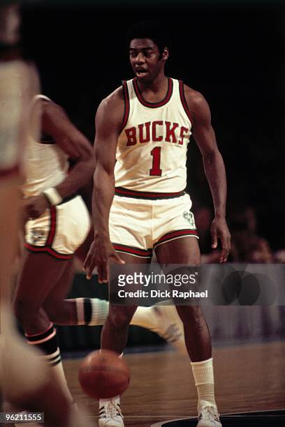 Oscar Robertson of the Milwaukee Bucks moves the ball up court against the Boston Celtics during a game played in 1973 at the Mecca in Milwaukee,...