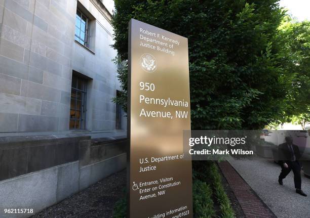 Man walks past the Justice Department, on May 24, 2018 in Washington, DC. Today lawmakers are attending classified meeting in regards to the FBI's...