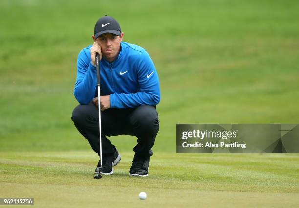 Rory McIlroy of Northern Ireland lines up a putt on the 13th green during day one of the 2018 BMW PGA Championship at Wentworth on May 24, 2018 in...