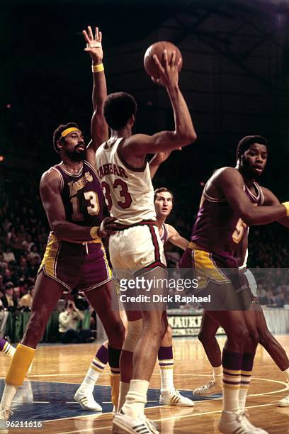 Kareem Abdul-Jabbar of the Milwaukee Bucks passes against Wilt Chamberlain of the Los Angeles Lakers during a game played in 1973 at the Mecca in...