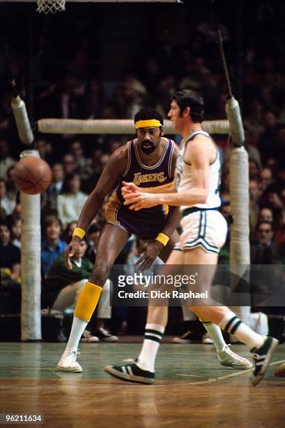 Wilt Chamberlain of the Los Angeles Lakers defends against the Boston Celtics during a game played in 1972 at the Boston Garden in Boston,...