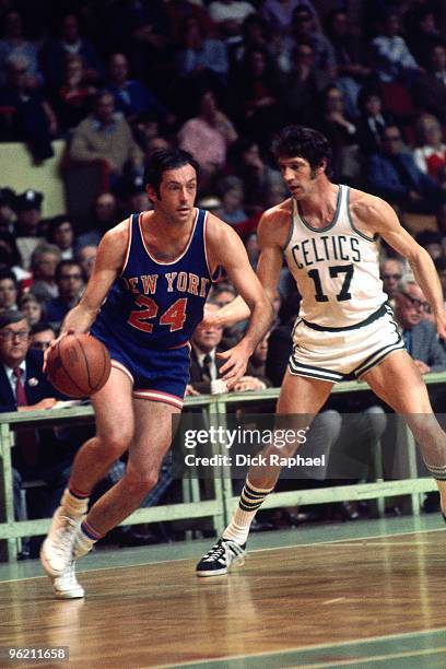 Bill Bradley of the New York Knicks moves the ball against John Havlicek of the Boston Celtics during a game played in 1973 at the Boston Garden in...