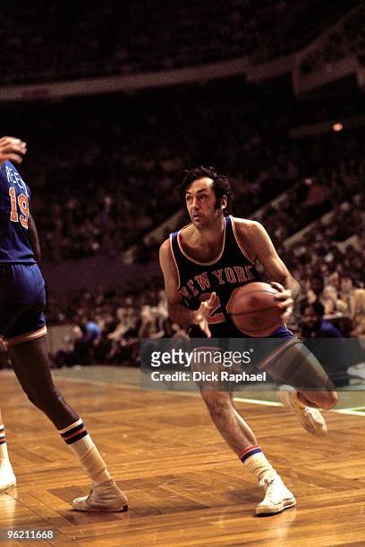 Bill Bradley of the New York Knicks moves the ball up court against the Boston Celtics during a game played in 1972 at the Boston Garden in Boston,...