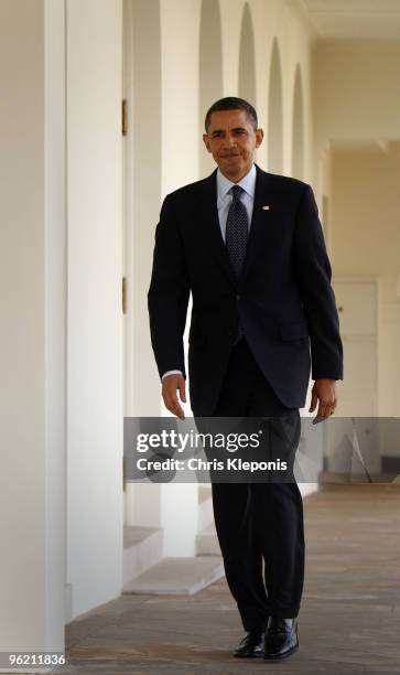 President Barack Obama walks along the colonnade of The White House to the Oval Office January 27, 2010 in Washington, DC. Later this evening Obama...