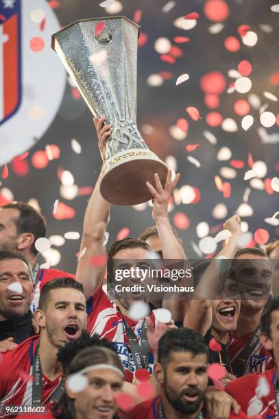 Gabi raises the trophy as Atletico Madrid celebrate winning the UEFA Europa League Final between Olympique de Marseille and Club Atletico de Madrid...