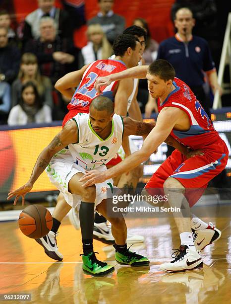 Juan Dixon, #13 of Unicaja competes with Viktor Khryapa, #31 of CSKA Moscow in action during the Euroleague Basketball 2009-2010 Last 16 Game 1...