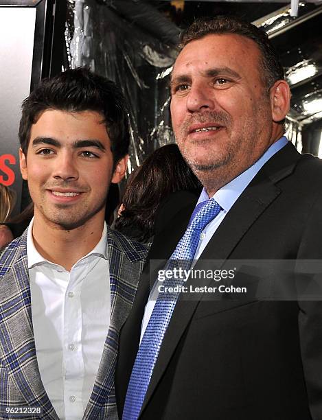 Musician Joe Jonas and producer Tim Headington arrive at the "Edge Of Darkness" premiere held at Grauman's Chinese Theatre on January 26, 2010 in...