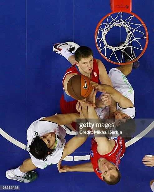 Viktor Khryapa, #31 and Ramunas Siskauskas, #9 of CSKA Moscow competes with Georgios Printezis, #7 and Augusto Cesar Lima, #17 of Unicaja in action...