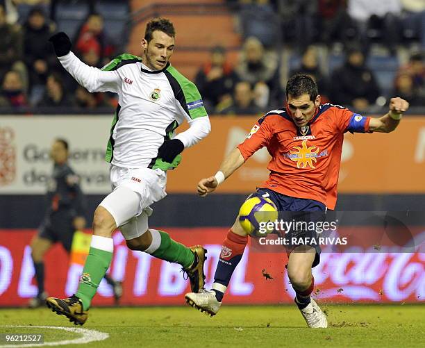 Osasuna's Josetxo Romero vies with Racing's Francisco Jimenez "Xisco" during a Spanish King's Cup quarter final second leg match at Reyno de Navarra...